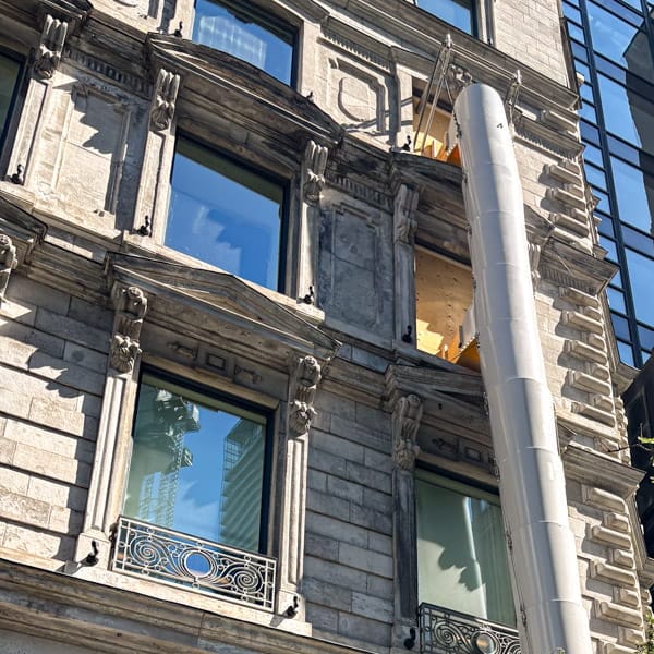 White chute on building close up. White chute on building close up.